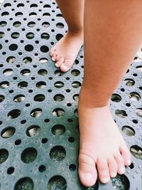 Low section of child standing on floor