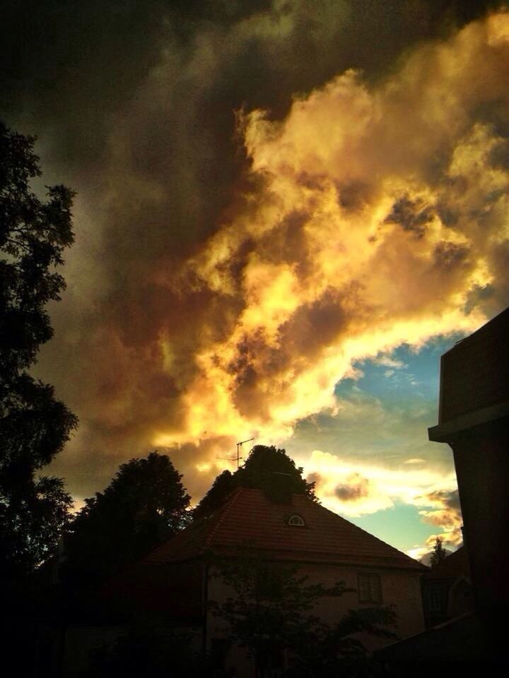 sunset, sky, silhouette, building exterior, architecture, built structure, cloud - sky, low angle view, house, orange color, beauty in nature, tree, scenics, cloud, cloudy, dramatic sky, nature, residential structure, outdoors, residential building