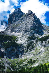 Low angle view of rock formation against sky