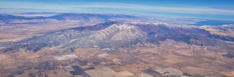 High angle view of mountain range against cloudy sky