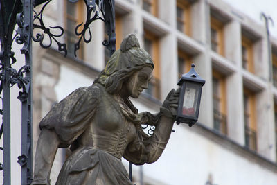 Low angle view of statue against building