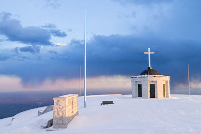 Building against sky during winter