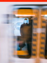 Blurred motion of train at railroad station
