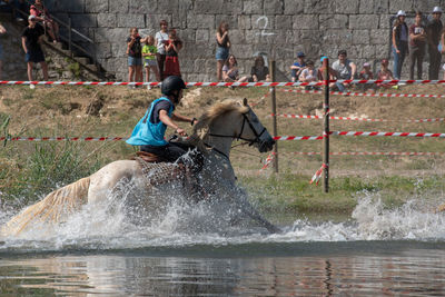 People enjoying at water