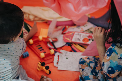 High angle view of girl playing at home