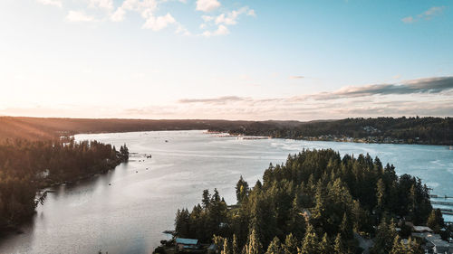 Scenic view of lake against sky during sunset