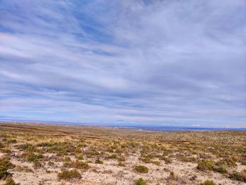 Scenic view of land against sky