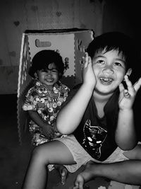 Portrait of siblings sitting