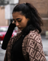 Side view of young woman looking away