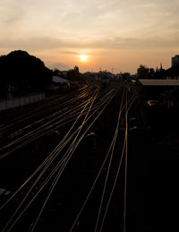 High angle view of railroad tracks against sky during sunset