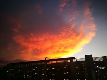 Low angle view of silhouette cityscape against sky during sunset