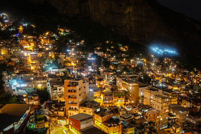 High angle view of illuminated buildings in city at night