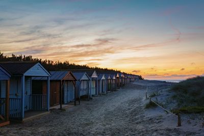 Scenic view of beach against sky during sunset