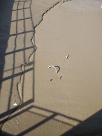 High angle view of shadow on sand