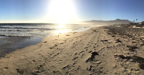 Scenic view of beach against clear sky