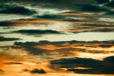 Low angle view of dramatic sky during sunset