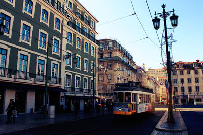 Buildings in city against sky