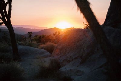 Scenic view of mountains against sky during sunset