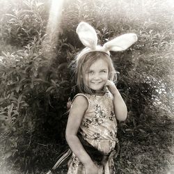 Portrait of smiling girl on field