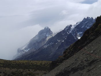 Scenic view of snowcapped mountains against sky