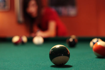 Woman playing pool