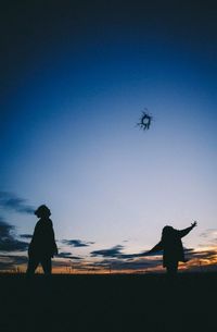 Silhouette of people on beach