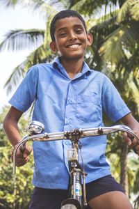 Portrait of a schoolboy on bicycle