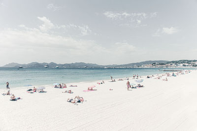 High angle view of people on beach against sky