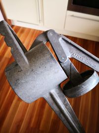 High angle view of chain hanging on chair at home