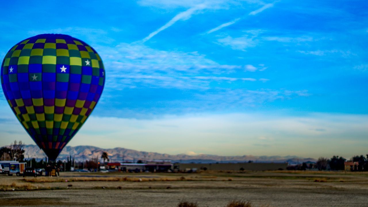 HOT AIR BALLOONS AGAINST SKY