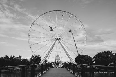 Low angle view of ferris wheel against sky