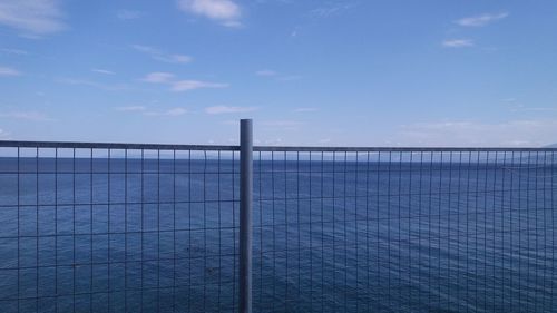 Scenic view of sea against blue sky