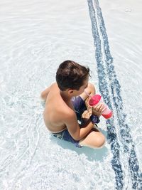 High angle view of boy in swimming pool