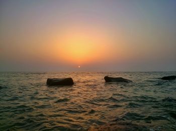 Scenic view of sea at sunset