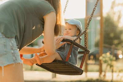 Low section of man working at playground