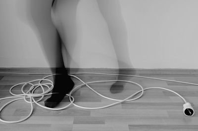 Low section of person wearing canvas shoes