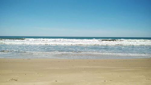 Scenic view of sea against clear sky