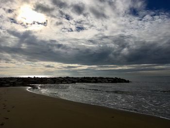 Scenic view of beach against sky