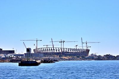 Ship in sea against clear sky