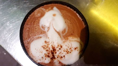 Close-up of cappuccino on table