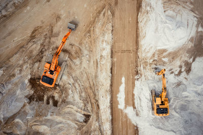 Aerial view of excavator working in construction site