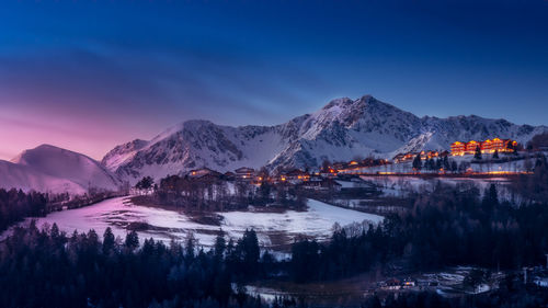 Snowcapped mountains against sky during a colorful sunset in winter near rodengo 