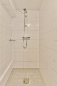 Low angle view of shower head in bathroom