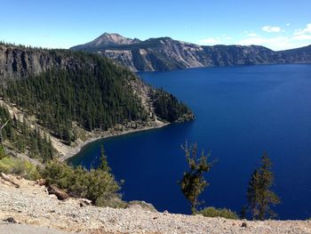 Scenic view of lake and mountains against sky