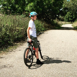 Man riding bicycle on road