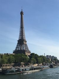 Tower in city against sky