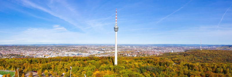 Scenic view of trees and buildings against sky