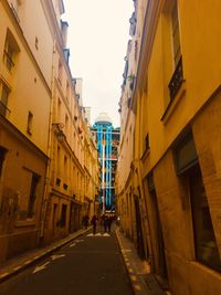 Narrow alley amidst buildings in city