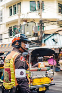 Rear view of man standing on street