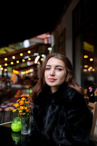 Portrait of young woman with illuminated hair